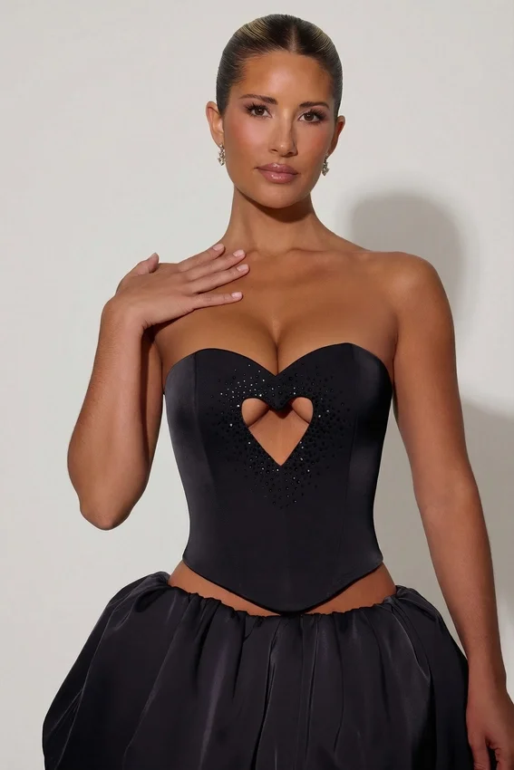 Amora Embellished Heart Cut-Out Strapless Corset Top i svart Amora Embellished Heart Cut-Out Strapless Corset Top i svart