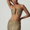 Ariana Embellished Cut-Out Crop Top i guld Ariana Embellished Cut-Out Crop Top i guld