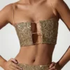 Ariana Embellished Cut-Out Crop Top i guld Ariana Embellished Cut-Out Crop Top i guld