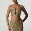 Ariana Embellished Cut-Out Crop Top i guld Ariana Embellished Cut-Out Crop Top i guld
