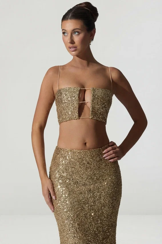 Ariana Embellished Cut-Out Crop Top i guld Ariana Embellished Cut-Out Crop Top i guld