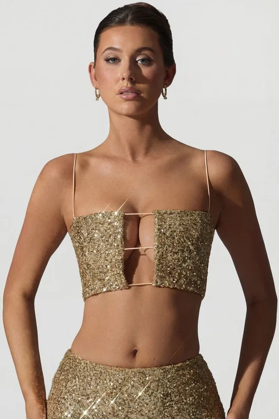 Ariana Embellished Cut-Out Crop Top i guld Ariana Embellished Cut-Out Crop Top i guld