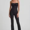 Arlena Jumpsuit med spets och rosettdetaljer i svart Arlena Jumpsuit med spets och rosettdetaljer i svart