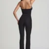 Arlena Jumpsuit med spets och rosettdetaljer i svart Arlena Jumpsuit med spets och rosettdetaljer i svart
