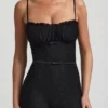 Arlena Jumpsuit med spets och rosettdetaljer i svart Arlena Jumpsuit med spets och rosettdetaljer i svart