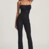 Arlena Jumpsuit med spets och rosettdetaljer i svart Arlena Jumpsuit med spets och rosettdetaljer i svart