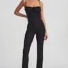 Arlena Jumpsuit med spets och rosettdetaljer i svart Arlena Jumpsuit med spets och rosettdetaljer i svart