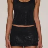 Asta Embellished Mid-Rise A-Line Mini Kjol i svart Asta Embellished Mid-Rise A-Line Mini Kjol i svart