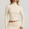 Auri Modal Ruched Backless Turtleneck Top i Ivory Auri Modal Ruched Backless Turtleneck Top i Ivory