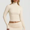 Auri Modal Ruched Backless Turtleneck Top i Ivory Auri Modal Ruched Backless Turtleneck Top i Ivory