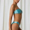 Bandeau-bikinitopp med detaljer i sötvattenspärlor i turkos Bandeau-bikinitopp med detaljer i sötvattenspärlor i turkos