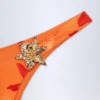 Beqa Bikinibyxor med metalldetaljer i orange orkidé-mönster Beqa Bikinibyxor med metalldetaljer i orange orkidé-mönster