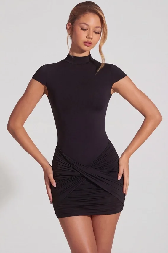 Blair Jersey Turtleneck Ruched Backless Miniklänning i svart Blair Jersey Turtleneck Ruched Backless Miniklänning i svart