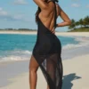 Caicos maxiklänning med utskärningar och halterneck i svart Caicos maxiklänning med utskärningar och halterneck i svart