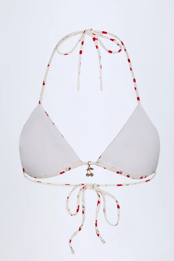 Calella triangel-bikinitopp med charmdetaljer i körsbärsmönster Calella triangel-bikinitopp med charmdetaljer i körsbärsmönster