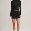 Cali Modal Ruched Mid-Rise Mini Kjol i svart Cali Modal Ruched Mid-Rise Mini Kjol i svart