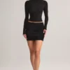 Cali Modal Ruched Mid-Rise Mini Kjol i svart Cali Modal Ruched Mid-Rise Mini Kjol i svart