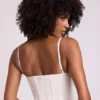 Cassandra vinylkorsett-crop-top med bygel i vitt Cassandra vinylkorsett-crop-top med bygel i vitt
