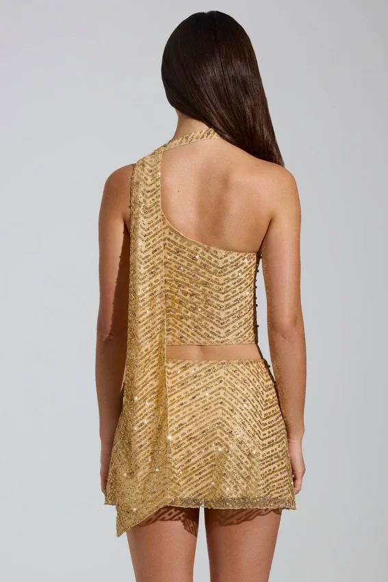Cosette-top med asymmetrisk scarf-detalj i guld Cosette-top med asymmetrisk scarf-detalj i guld