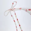 Cove Side-Tie Cheeky bikinibyxor i körsbärsmönster Cove Side-Tie Cheeky bikinibyxor i körsbärsmönster