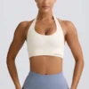 Define Luxe sport-BH med halterneck i vitt Define Luxe sport-BH med halterneck i vitt
