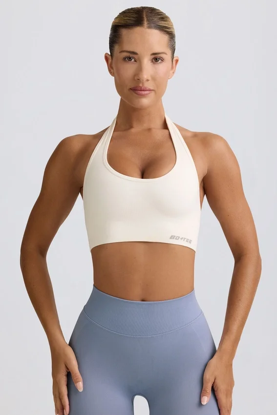 Define Luxe sport-BH med halterneck i vitt Define Luxe sport-BH med halterneck i vitt
