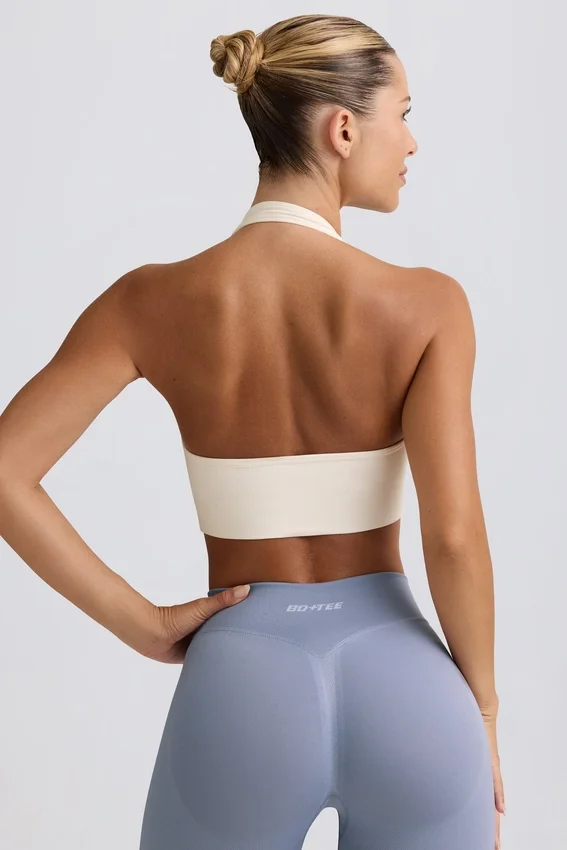 Define Luxe sport-BH med halterneck i vitt Define Luxe sport-BH med halterneck i vitt