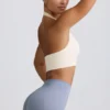 Define Luxe sport-BH med halterneck i vitt Define Luxe sport-BH med halterneck i vitt