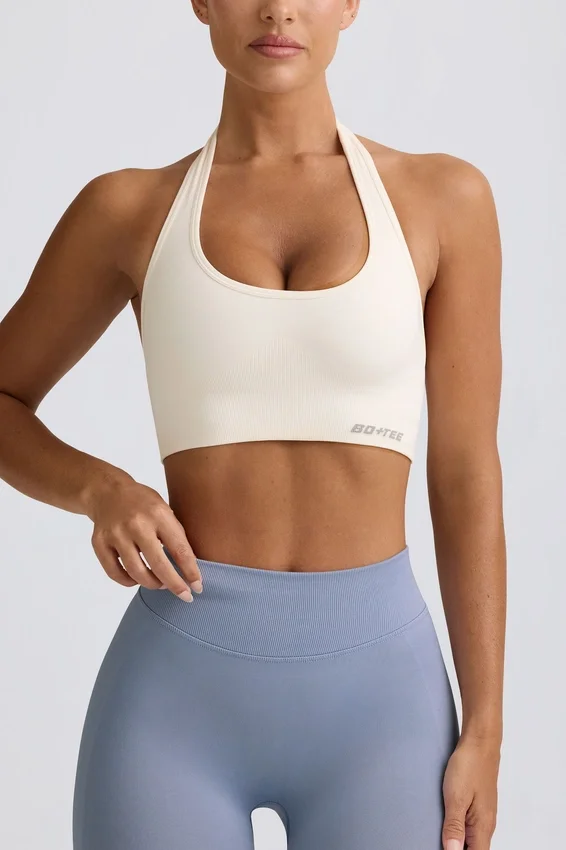 Define Luxe sport-BH med halterneck i vitt Define Luxe sport-BH med halterneck i vitt