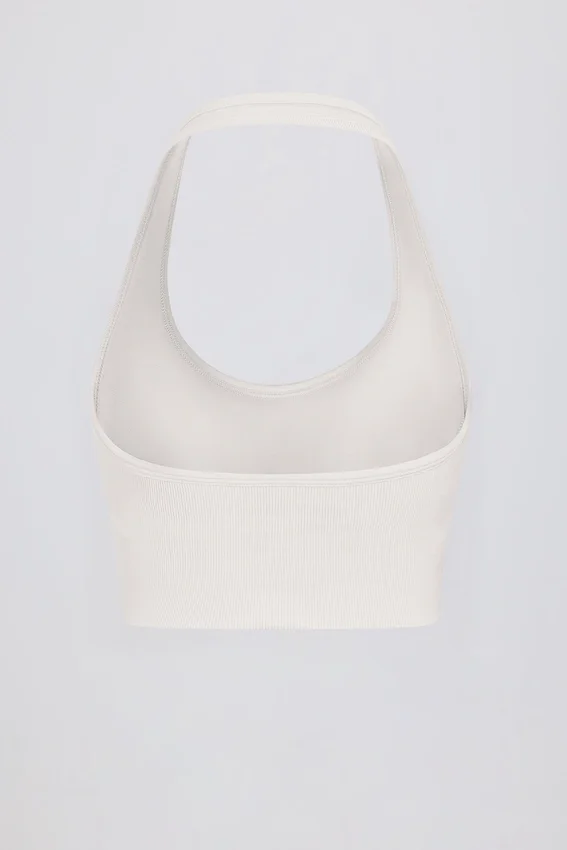 Define Luxe sport-BH med halterneck i vitt Define Luxe sport-BH med halterneck i vitt
