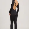Eulalie Slinky Jersey Jumpsuit med rosettdetalj i svart Eulalie Slinky Jersey Jumpsuit med rosettdetalj i svart