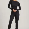 Eulalie Slinky Jersey Jumpsuit med rosettdetalj i svart Eulalie Slinky Jersey Jumpsuit med rosettdetalj i svart