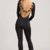 Eulalie Slinky Jersey Jumpsuit med rosettdetalj i svart Eulalie Slinky Jersey Jumpsuit med rosettdetalj i svart