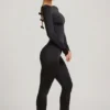 Eulalie Slinky Jersey Jumpsuit med rosettdetalj i svart Eulalie Slinky Jersey Jumpsuit med rosettdetalj i svart