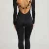 Eulalie Slinky Jersey Jumpsuit med rosettdetalj i svart Eulalie Slinky Jersey Jumpsuit med rosettdetalj i svart