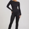 Eulalie Slinky Jersey Jumpsuit med rosettdetalj i svart Eulalie Slinky Jersey Jumpsuit med rosettdetalj i svart