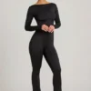 Eulalie Slinky Jersey Jumpsuit med rosettdetalj i svart Eulalie Slinky Jersey Jumpsuit med rosettdetalj i svart