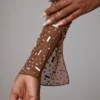 Guilia genomskinlig, dekorerad kort topp med långa ärmar i färgen Mocha Guilia genomskinlig, dekorerad kort topp med långa ärmar i färgen Mocha