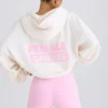 Hoodie i strukturerad bomullsjersey med grafiskt tryck i vitt Hoodie i strukturerad bomullsjersey med grafiskt tryck i vitt