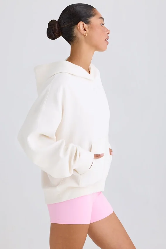 Hoodie i strukturerad bomullsjersey med grafiskt tryck i vitt Hoodie i strukturerad bomullsjersey med grafiskt tryck i vitt