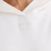 Hoodie i strukturerad bomullsjersey med grafiskt tryck i vitt Hoodie i strukturerad bomullsjersey med grafiskt tryck i vitt