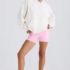 Hoodie i strukturerad bomullsjersey med grafiskt tryck i vitt Hoodie i strukturerad bomullsjersey med grafiskt tryck i vitt