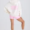 Hoodie i strukturerad bomullsjersey med grafiskt tryck i vitt Hoodie i strukturerad bomullsjersey med grafiskt tryck i vitt