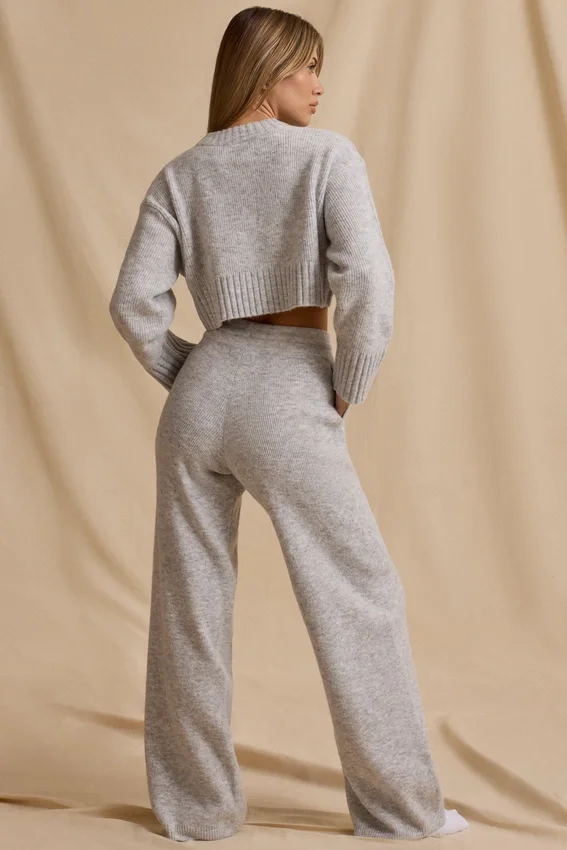 Joggingbyxor i ribbad stickning med medelhög midja och vida ben i isgrå melerad Joggingbyxor i ribbad stickning med medelhög midja och vida ben i isgrå melerad