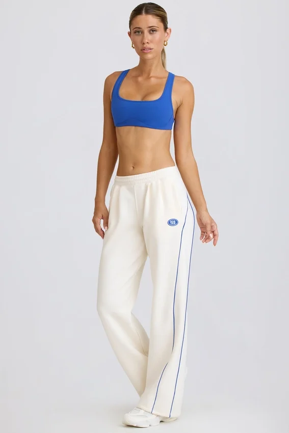 Joggingbyxor med medelhög midja och raka ben i vitt Joggingbyxor med medelhög midja och raka ben i vitt