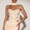 Junelle Embellished Lace-Up Corset Top med scarf i guld Junelle Embellished Lace-Up Corset Top med scarf i guld