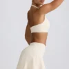 Korsad miniskort i borstad jersey i ivory marl Korsad miniskort i borstad jersey i ivory marl
