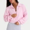 Kort sweatshirt i ribbad stickning med dragkedja i ljusrosa Kort sweatshirt i ribbad stickning med dragkedja i ljusrosa