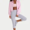 Kort sweatshirt i ribbad stickning med dragkedja i ljusrosa Kort sweatshirt i ribbad stickning med dragkedja i ljusrosa
