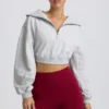 Kort sweatshirt med kvartslång dragkedja i gråmelerat Kort sweatshirt med kvartslång dragkedja i gråmelerat